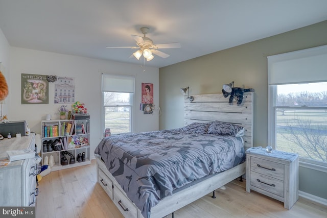 bedroom featuring light wood-type flooring and ceiling fan