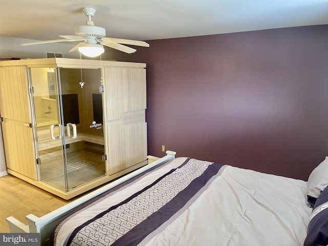 bedroom with hardwood / wood-style flooring and ceiling fan