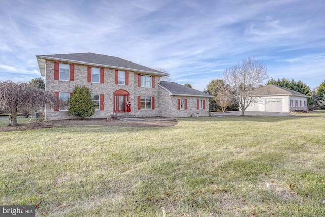 view of front of house with a garage and a front yard