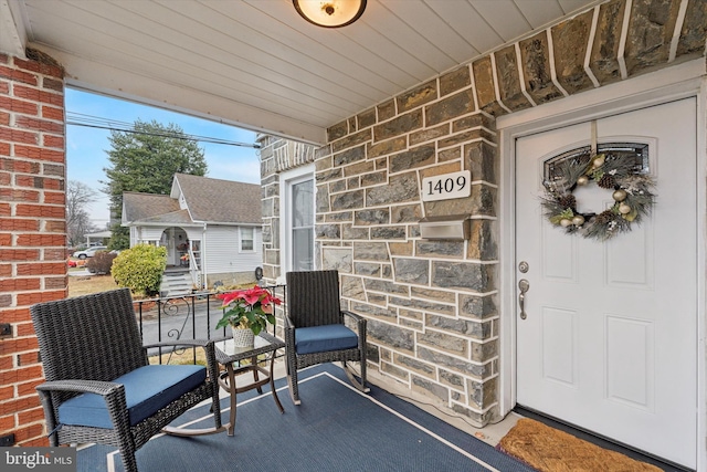 entrance to property with covered porch