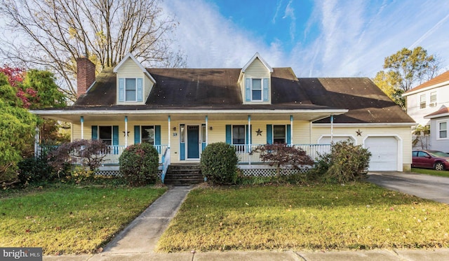 view of front facade featuring a front lawn, a porch, and a garage