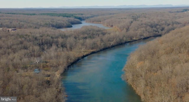 drone / aerial view with a water and mountain view