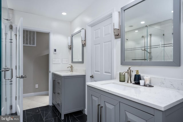 bathroom with vanity and an enclosed shower