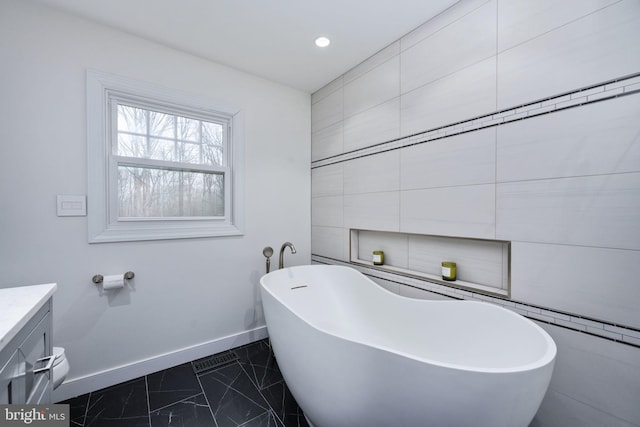 bathroom with a bath and vanity