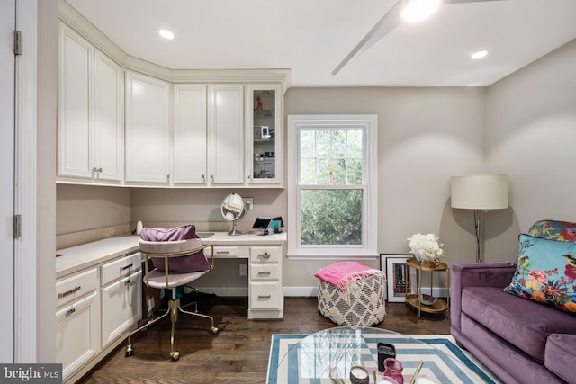 office featuring built in desk and dark wood-type flooring