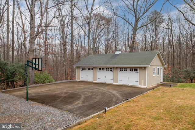 garage featuring a yard