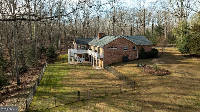 exterior space featuring a yard and cooling unit