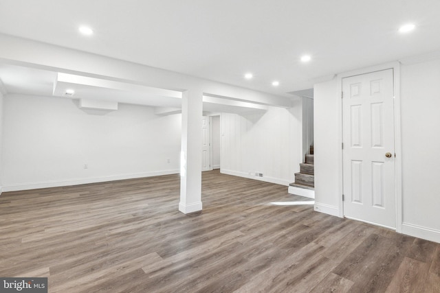 basement featuring hardwood / wood-style floors