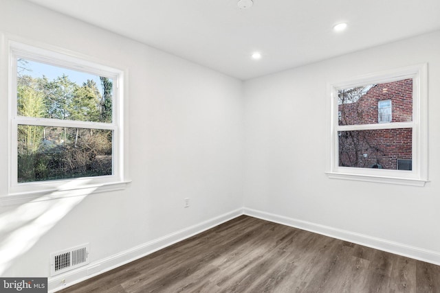 empty room featuring dark wood-type flooring