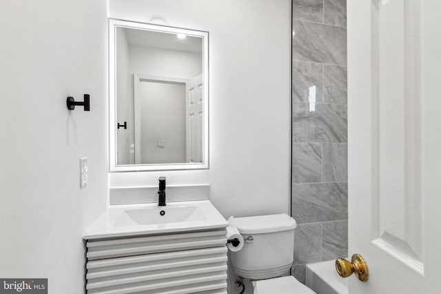 bathroom with vanity and toilet