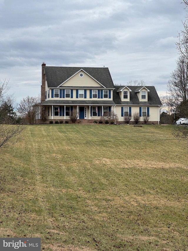 view of front facade featuring a front yard and covered porch