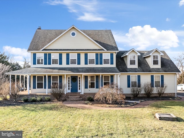 view of front of property with a porch and a front yard