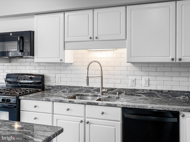 kitchen featuring black appliances, decorative backsplash, white cabinetry, and sink