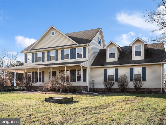 view of front of house featuring a front yard and covered porch