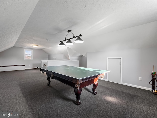 playroom featuring lofted ceiling, dark carpet, a textured ceiling, and a baseboard heating unit