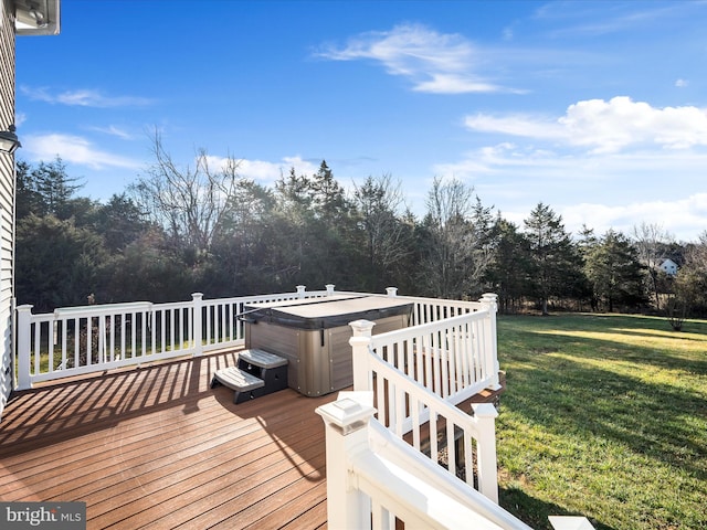 wooden deck with a lawn and a hot tub