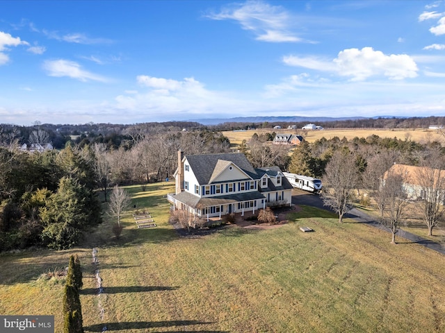 birds eye view of property featuring a rural view