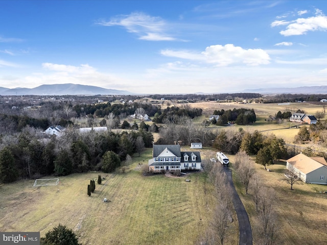 aerial view with a mountain view and a rural view