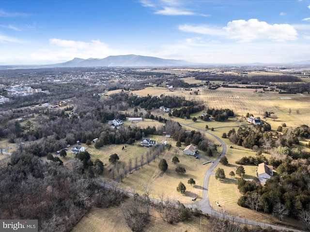 birds eye view of property with a mountain view and a rural view