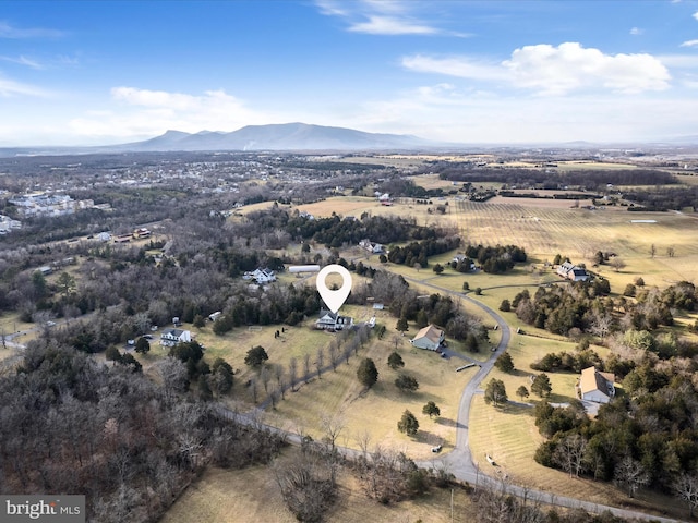 birds eye view of property with a mountain view and a rural view