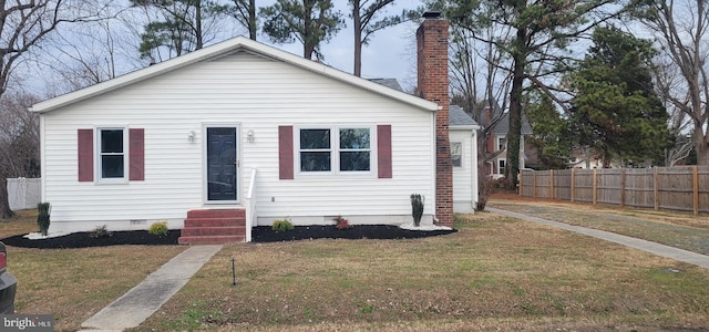 bungalow-style home with a front lawn