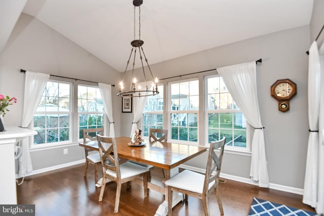 dining area with a notable chandelier, dark hardwood / wood-style floors, and vaulted ceiling