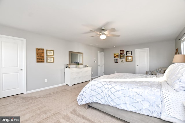 bedroom with ceiling fan and light colored carpet