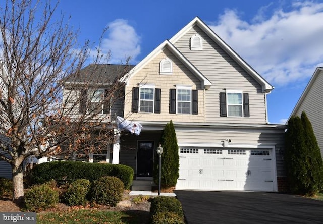 front of property with a garage