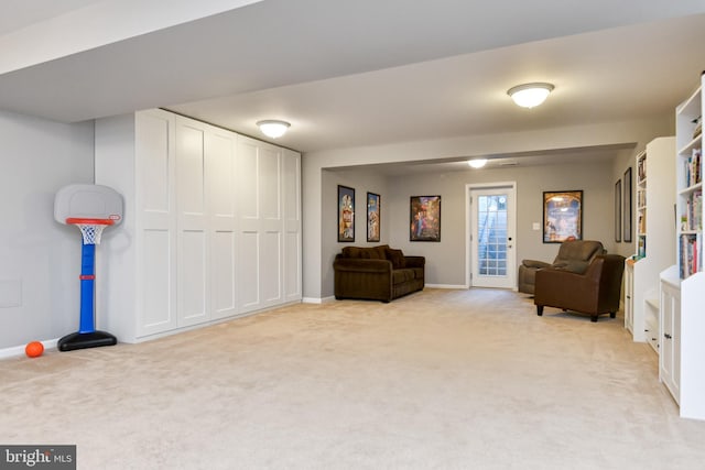 sitting room featuring light colored carpet