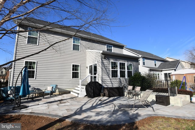 rear view of house featuring a patio