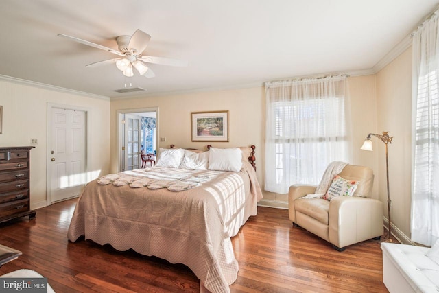 bedroom with visible vents, baseboards, ceiling fan, ornamental molding, and wood finished floors