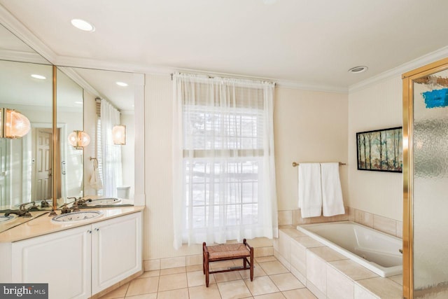 full bathroom with tile patterned flooring, a garden tub, vanity, and ornamental molding