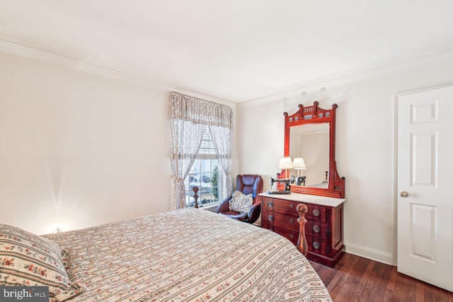 bedroom with baseboards, dark wood-style flooring, and ornamental molding