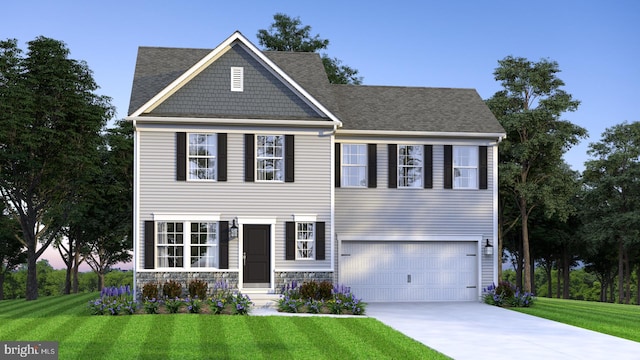 view of front of home featuring a yard and a garage