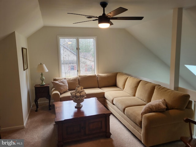 living room featuring ceiling fan, carpet floors, and vaulted ceiling