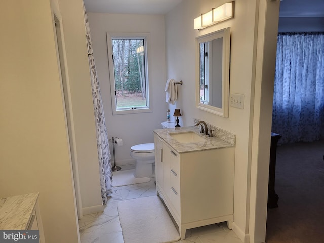 bathroom featuring vanity and toilet