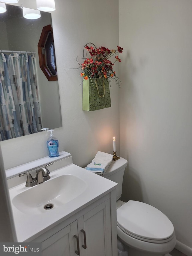 bathroom with vanity and toilet