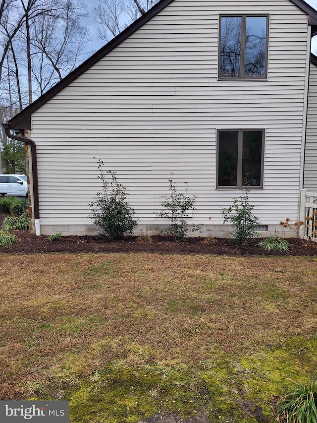 view of property exterior featuring a yard