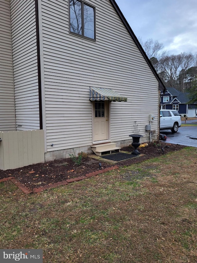 view of home's exterior with a yard