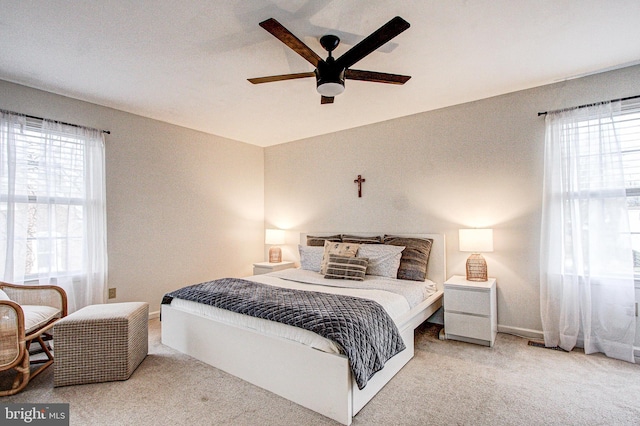 bedroom with ceiling fan and carpet floors