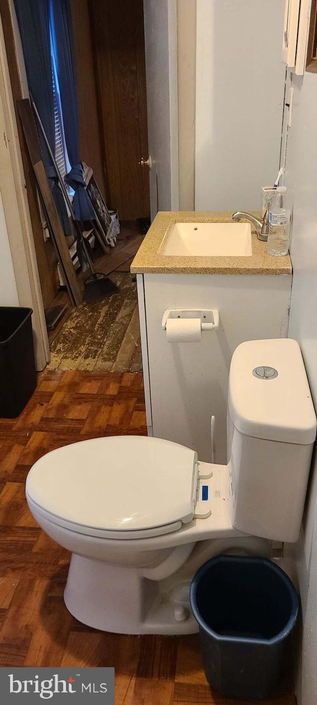 half bathroom with a sink and toilet