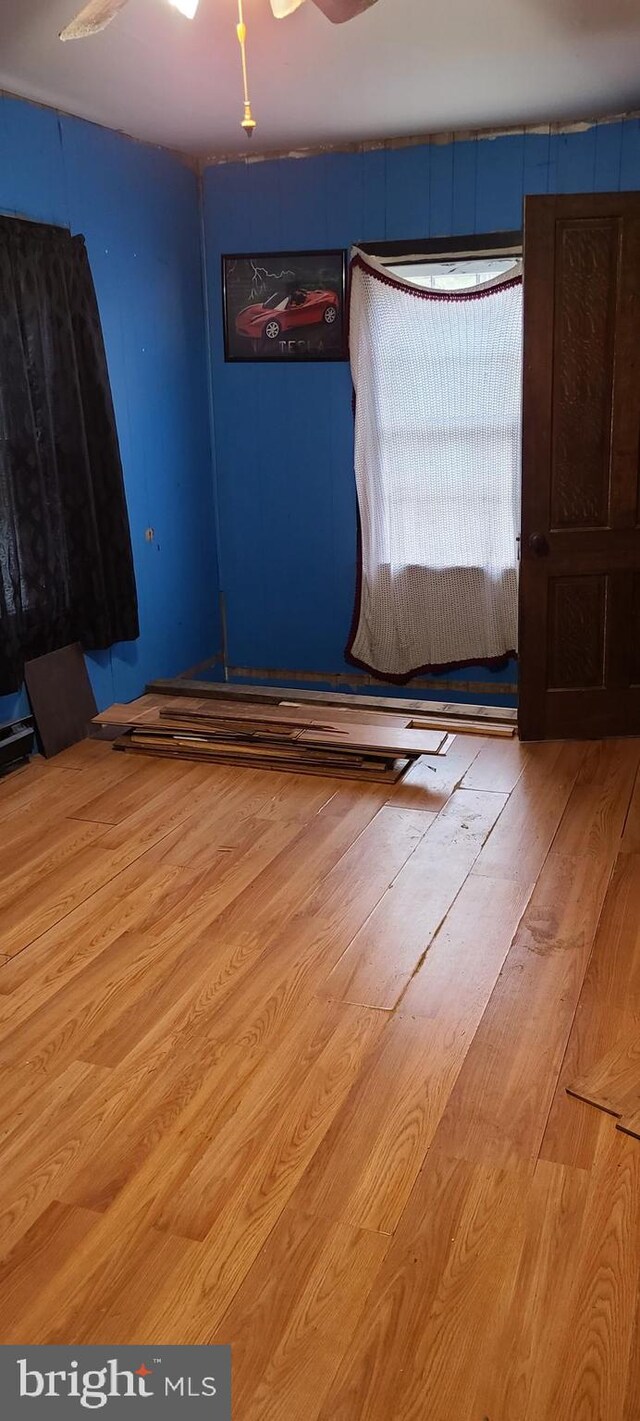 unfurnished bedroom with wood finished floors