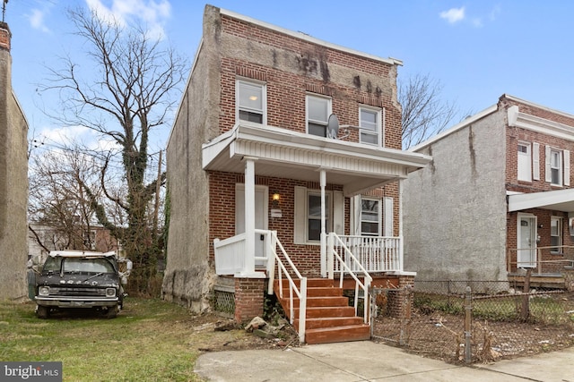 townhome / multi-family property with covered porch