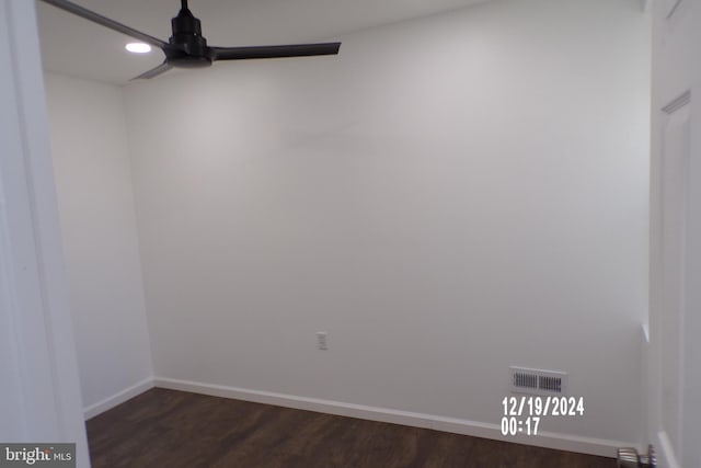 unfurnished room featuring dark hardwood / wood-style floors and ceiling fan