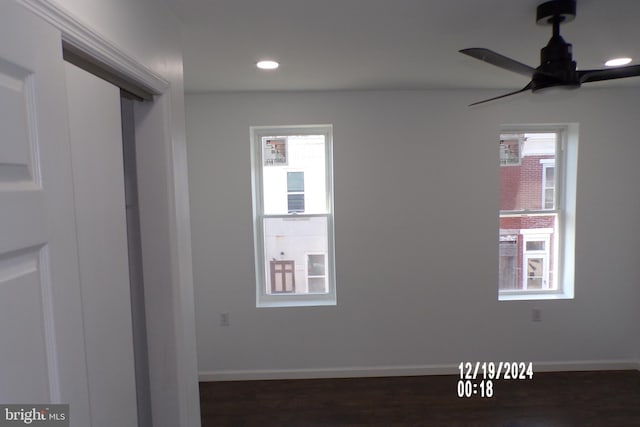 spare room with ceiling fan and dark hardwood / wood-style flooring