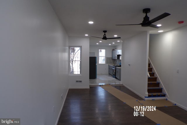 corridor featuring dark hardwood / wood-style floors