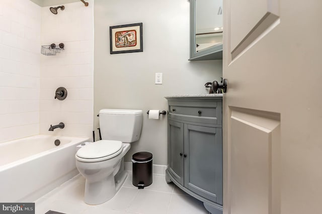 full bathroom featuring tile patterned floors, toilet, vanity, and tiled shower / bath