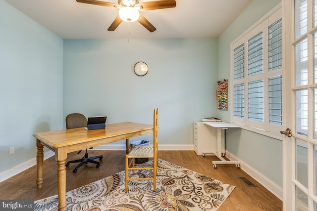 office area featuring ceiling fan, plenty of natural light, and light wood-type flooring