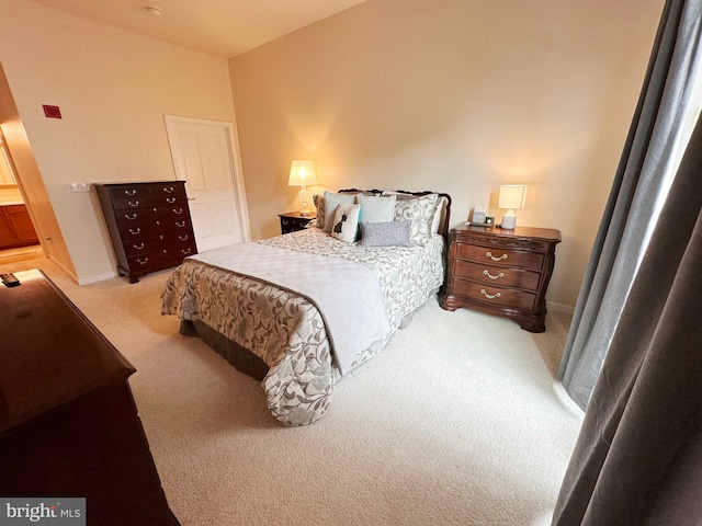 bedroom featuring light carpet