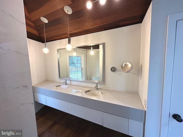 bathroom featuring vanity, wood ceiling, vaulted ceiling, and hardwood / wood-style flooring